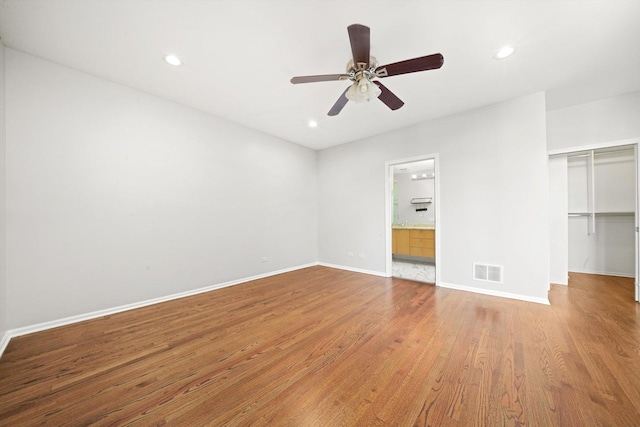 1550 N Leavitt St Unit 1550, Chicago, IL 60622 - unfurnished bedroom featuring wood finished floors, a closet, recessed lighting, ceiling fan, and a walk in closet