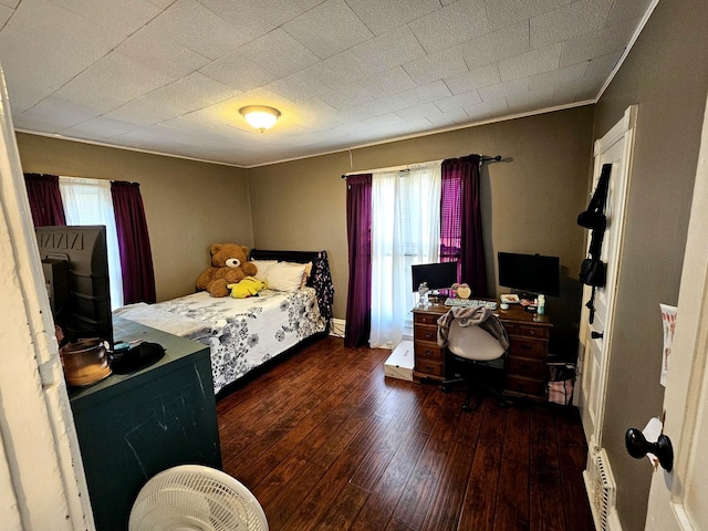 310 Hill Ave, Elgin, IL 60120 - bedroom with multiple windows, wood-type flooring, crown molding, an office area, and baseboard heating