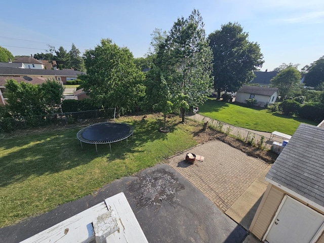 310 Hill Ave, Elgin, IL 60120 - view of yard featuring a trampoline and a patio