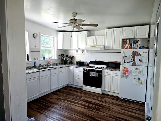 310 Hill Ave, Elgin, IL 60120 - kitchen featuring range with gas stovetop, freestanding refrigerator, black microwave, backsplash, and dark wood-style floors