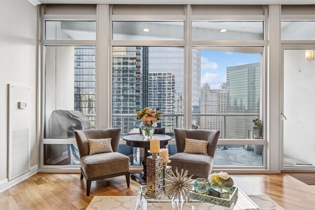 333 N Canal St Unit 2505, Chicago, IL 60606 - sitting room featuring plenty of natural light, wood finished floors, and a view of city