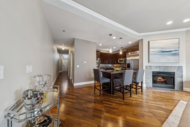 333 N Canal St Unit 2505, Chicago, IL 60606 - dining room featuring wood finished floors, recessed lighting, ornamental molding, and a fireplace
