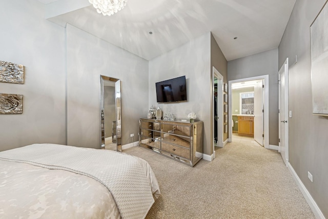 333 N Canal St Unit 2505, Chicago, IL 60606 - bedroom with light carpet, ensuite bath, and a chandelier