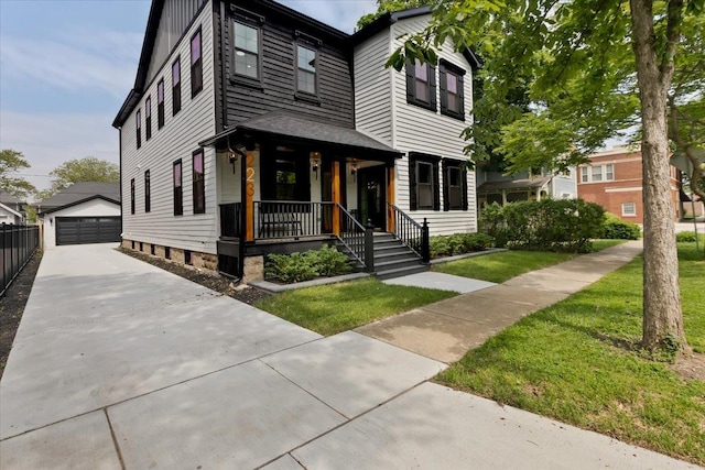223 Center St, Naperville, IL 60540 - view of front of home featuring covered porch, an outdoor structure, a detached garage, and a front lawn