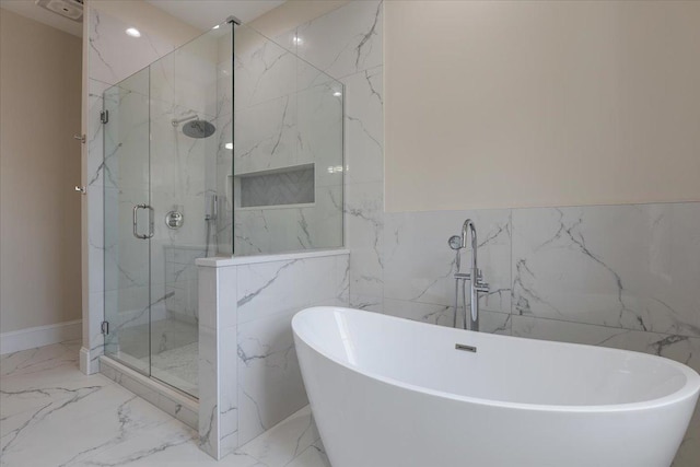 223 Center St, Naperville, IL 60540 - full bath with marble look tile flooring, a marble finish shower, tile walls, and a freestanding tub