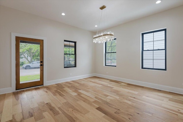 223 Center St, Naperville, IL 60540 - spare room with light wood-type flooring, a chandelier, recessed lighting, and baseboards