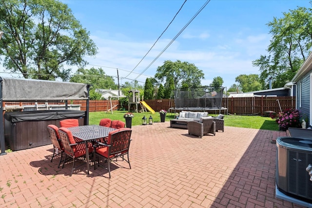7937 S Lotus Ave, Burbank, IL 60459 - view of patio featuring a hot tub, a trampoline, central AC, a playground, and outdoor dining space