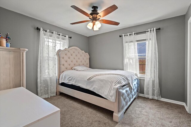 7937 S Lotus Ave, Burbank, IL 60459 - carpeted bedroom with baseboards and a ceiling fan