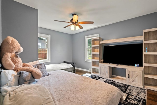 7937 S Lotus Ave, Burbank, IL 60459 - bedroom featuring wood finished floors, baseboards, and a ceiling fan