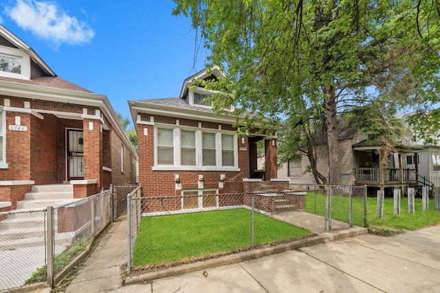 6742 S Honore St, Chicago, IL 60636 - view of front facade with a fenced front yard, brick siding, and a gate