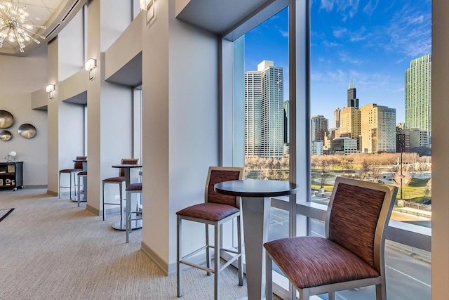 1211 S Prairie Ave Unit 1106, Chicago, IL 60605 - dining room featuring a chandelier, a view of skyline, and carpet