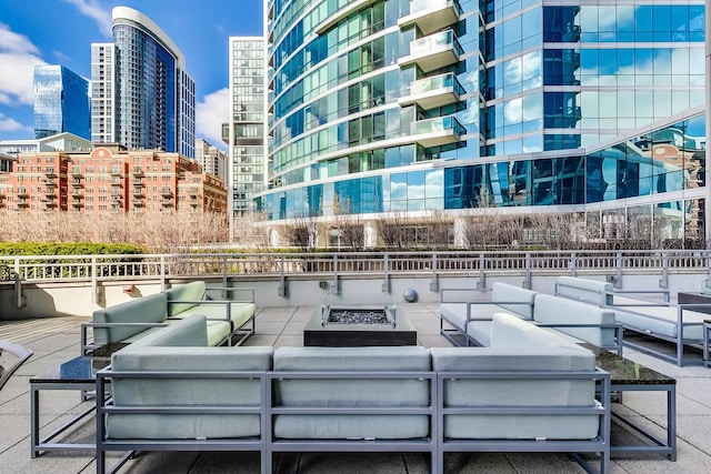 1211 S Prairie Ave Unit 1106, Chicago, IL 60605 - view of patio / terrace with an outdoor living space with a fire pit and a city view