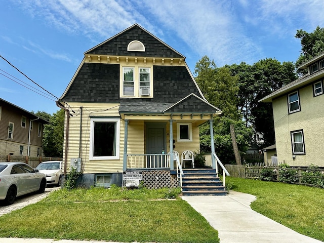 478 Barrett St, Elgin, IL 60120 - view of front of house featuring a porch and a shingled roof