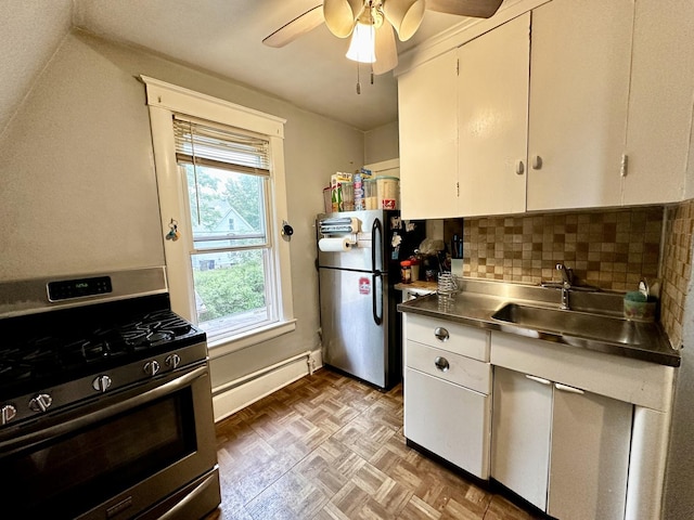 478 Barrett St, Elgin, IL 60120 - kitchen with stainless steel countertops, appliances with stainless steel finishes, a baseboard heating unit, white cabinets, and decorative backsplash