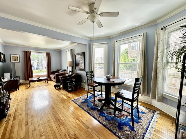 478 Barrett St, Elgin, IL 60120 - dining area with light wood finished floors, ceiling fan, baseboards, and ornamental molding