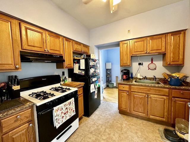 478 Barrett St, Elgin, IL 60120 - kitchen featuring range with gas stovetop, under cabinet range hood, a sink, brown cabinetry, and ceiling fan