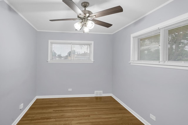 1205 N Irving Ave, Berkeley, IL 60163 - spare room with a ceiling fan, wood finished floors, crown molding, and baseboards