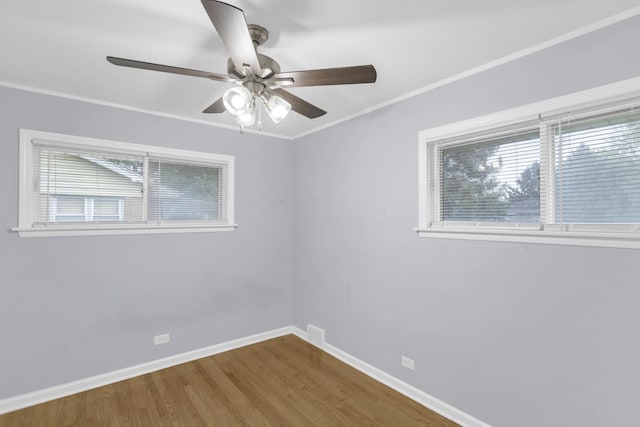 1205 N Irving Ave, Berkeley, IL 60163 - empty room featuring ceiling fan, wood finished floors, baseboards, and crown molding