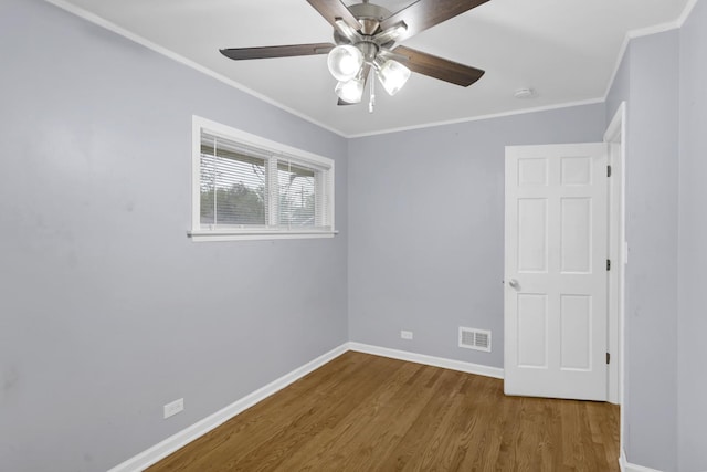 1205 N Irving Ave, Berkeley, IL 60163 - unfurnished room with wood finished floors, baseboards, ceiling fan, crown molding, and a smoke detector