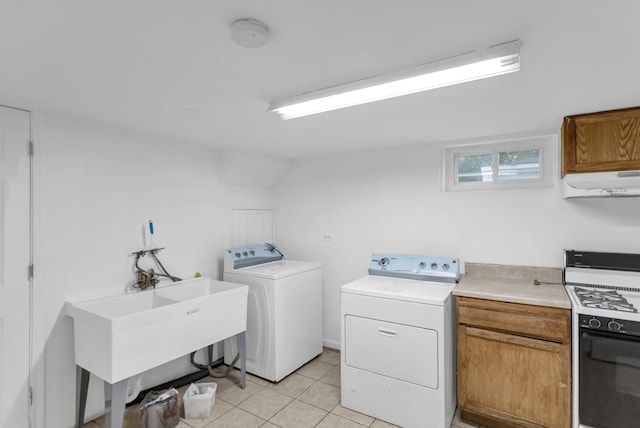 1205 N Irving Ave, Berkeley, IL 60163 - laundry area featuring washer and clothes dryer, light tile patterned flooring, and cabinet space