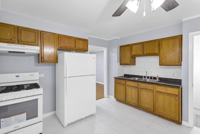 1205 N Irving Ave, Berkeley, IL 60163 - kitchen featuring white appliances, under cabinet range hood, a sink, and brown cabinets