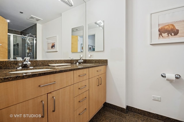 1201 W Adams St Unit 1001, Chicago, IL 60607 - bathroom featuring double vanity, a stall shower, and granite tiled floors