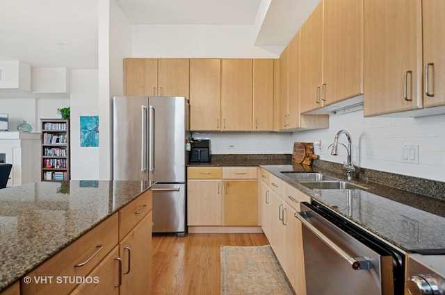 1201 W Adams St Unit 1001, Chicago, IL 60607 - kitchen with appliances with stainless steel finishes, dark stone countertops, light wood-style flooring, light brown cabinets, and tasteful backsplash