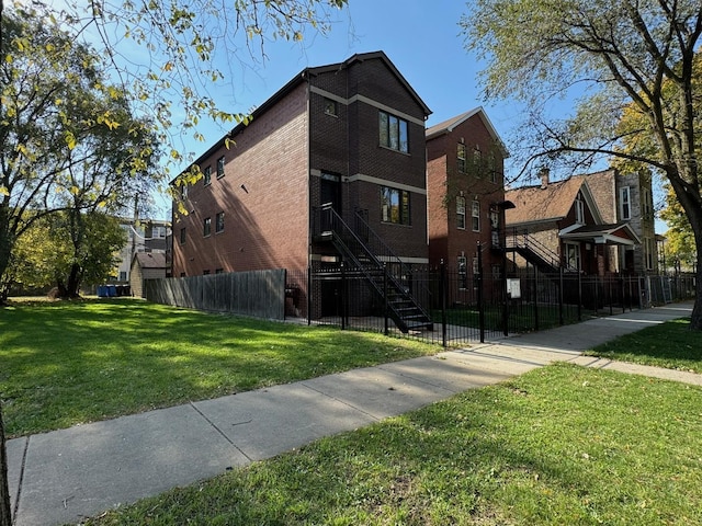 3037 W Polk Ave Unit 3, Chicago, IL 60612 - view of property featuring a fenced front yard and stairs