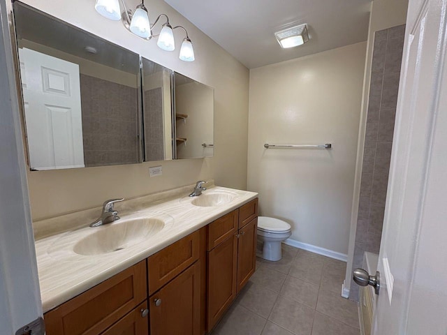 3037 W Polk Ave Unit 3, Chicago, IL 60612 - bathroom featuring tile patterned floors, double vanity, toilet, a shower, and baseboards