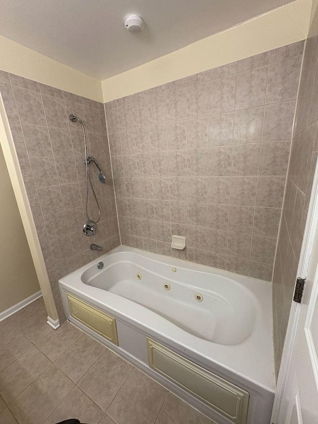 3037 W Polk Ave Unit 3, Chicago, IL 60612 - full bath featuring tile patterned flooring, a combined bath / shower with jetted tub, and baseboards