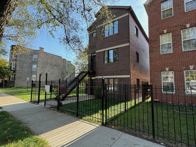 3037 W Polk Ave Unit 3, Chicago, IL 60612 - view of side of home with brick siding and stairs