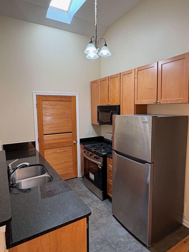3037 W Polk Ave Unit 3, Chicago, IL 60612 - kitchen with appliances with stainless steel finishes, a sink, a skylight, a chandelier, and a towering ceiling