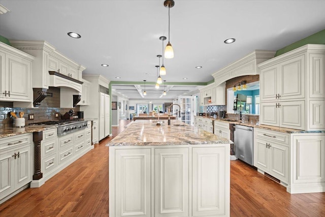 1810 Cardinal Ct, Pontiac, IL 61764 - kitchen with appliances with stainless steel finishes, decorative backsplash, wood finished floors, and recessed lighting
