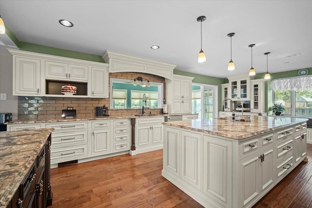 1810 Cardinal Ct, Pontiac, IL 61764 - kitchen with healthy amount of natural light, white cabinets, and recessed lighting