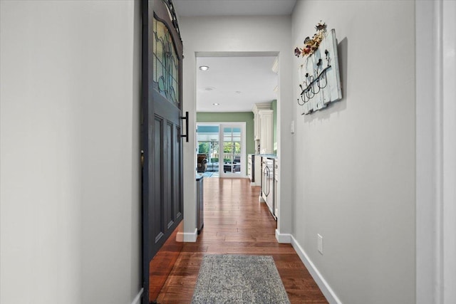 1810 Cardinal Ct, Pontiac, IL 61764 - hallway with dark wood-style floors and baseboards
