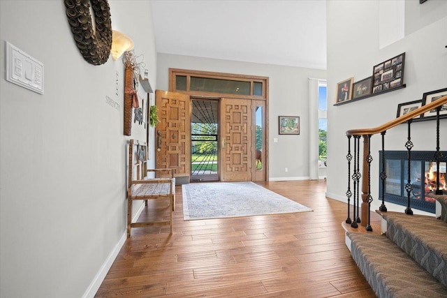 1810 Cardinal Ct, Pontiac, IL 61764 - entryway with hardwood / wood-style floors, a high ceiling, and stairway