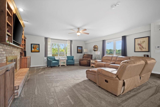 1810 Cardinal Ct, Pontiac, IL 61764 - carpeted living area featuring ceiling fan and a fireplace