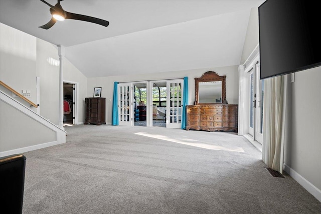 1810 Cardinal Ct, Pontiac, IL 61764 - unfurnished living room featuring lofted ceiling, carpet flooring, a ceiling fan, french doors, and stairs