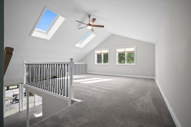1810 Cardinal Ct, Pontiac, IL 61764 - additional living space with a skylight, ceiling fan, carpet, and lofted ceiling