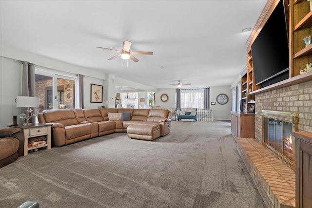 1810 Cardinal Ct, Pontiac, IL 61764 - carpeted living area with ceiling fan and a fireplace
