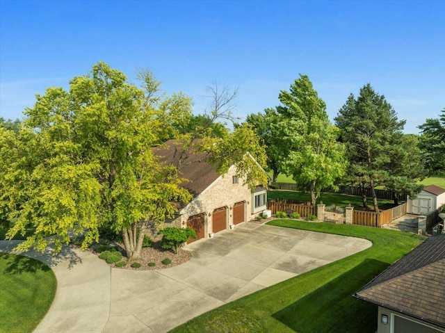 1810 Cardinal Ct, Pontiac, IL 61764 - view of property exterior featuring driveway, a storage shed, stone siding, and a garage