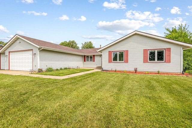 9650 Edgefield Rd, Roscoe, IL 61073 - ranch-style home with a front yard, an attached garage, and driveway