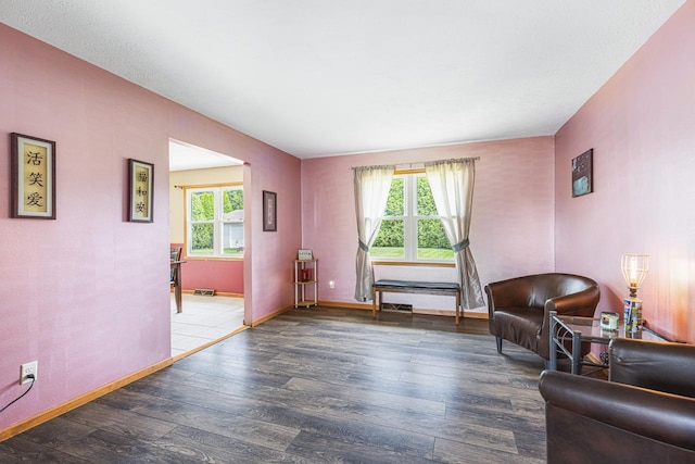 9650 Edgefield Rd, Roscoe, IL 61073 - sitting room with wood finished floors and baseboards