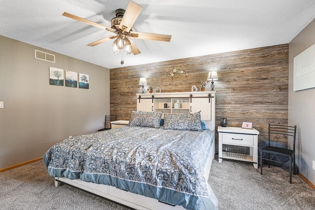 9650 Edgefield Rd, Roscoe, IL 61073 - bedroom featuring carpet flooring, baseboards, a ceiling fan, wood walls, and a textured ceiling