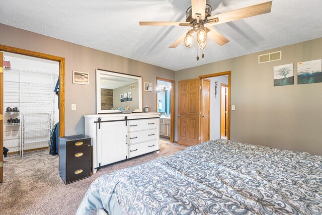 9650 Edgefield Rd, Roscoe, IL 61073 - bedroom featuring light carpet, a textured ceiling, a ceiling fan, and ensuite bath