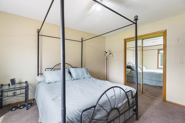 9650 Edgefield Rd, Roscoe, IL 61073 - bedroom with carpet flooring, a closet, baseboards, and a ceiling fan