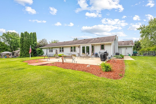 9650 Edgefield Rd, Roscoe, IL 61073 - rear view of house featuring a patio, a yard, and central air condition unit
