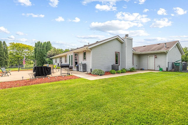 9650 Edgefield Rd, Roscoe, IL 61073 - back of property featuring a patio, cooling unit, and a chimney