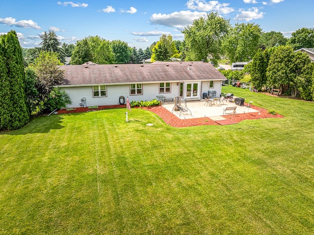9650 Edgefield Rd, Roscoe, IL 61073 - rear view of house featuring a patio area, a yard, and roof with shingles
