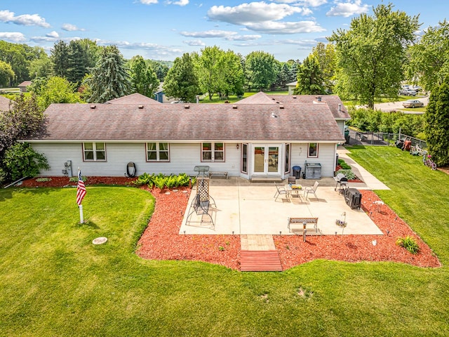 9650 Edgefield Rd, Roscoe, IL 61073 - rear view of house featuring a shingled roof, a patio area, and french doors